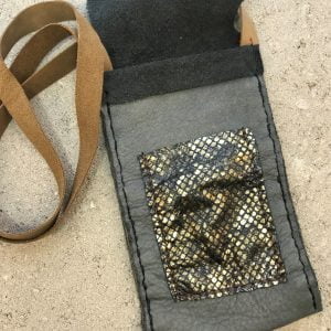 Gray and gold hand stitched leather bag